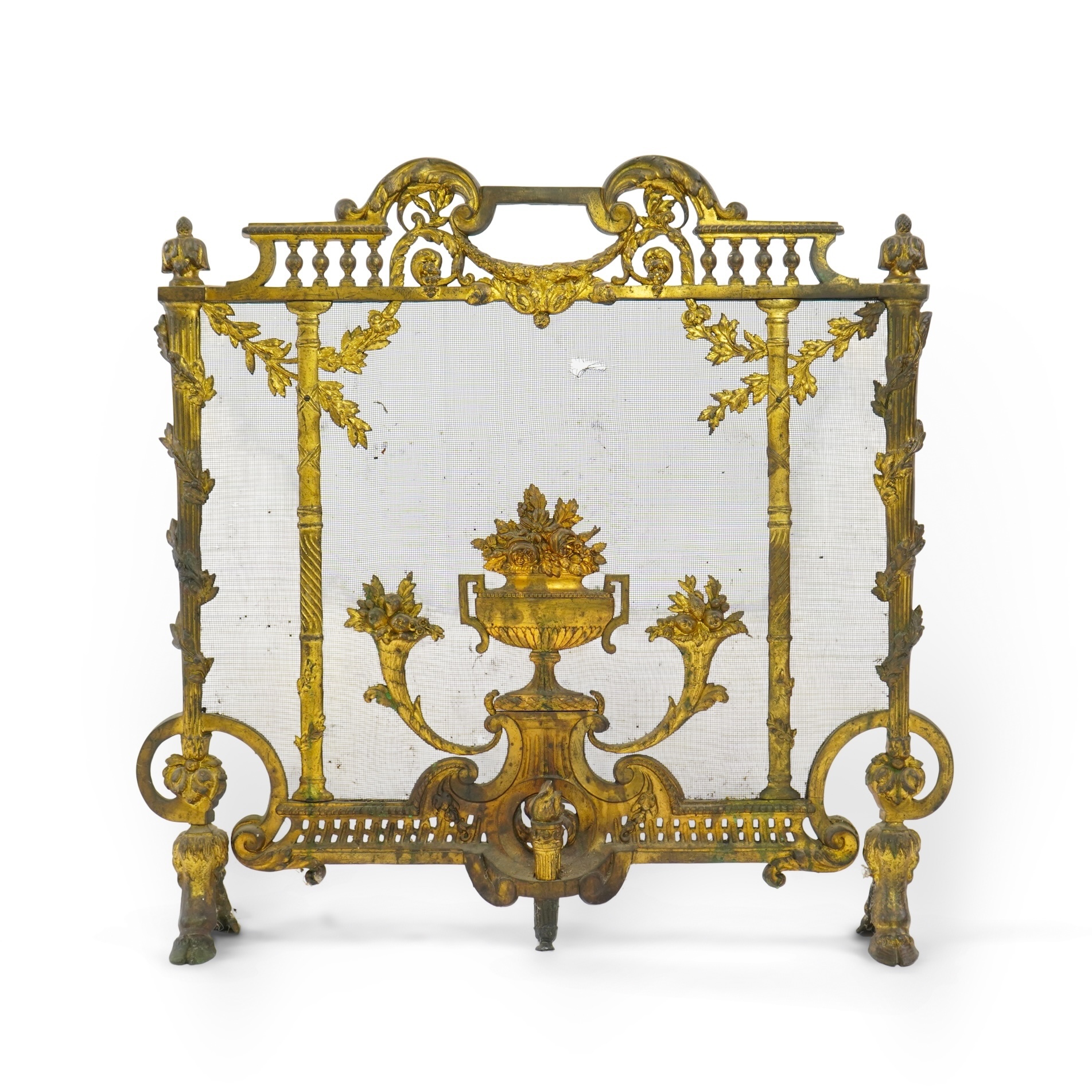 A Louis XVI style gilt bronze and iron mesh fireguard, late 19th century